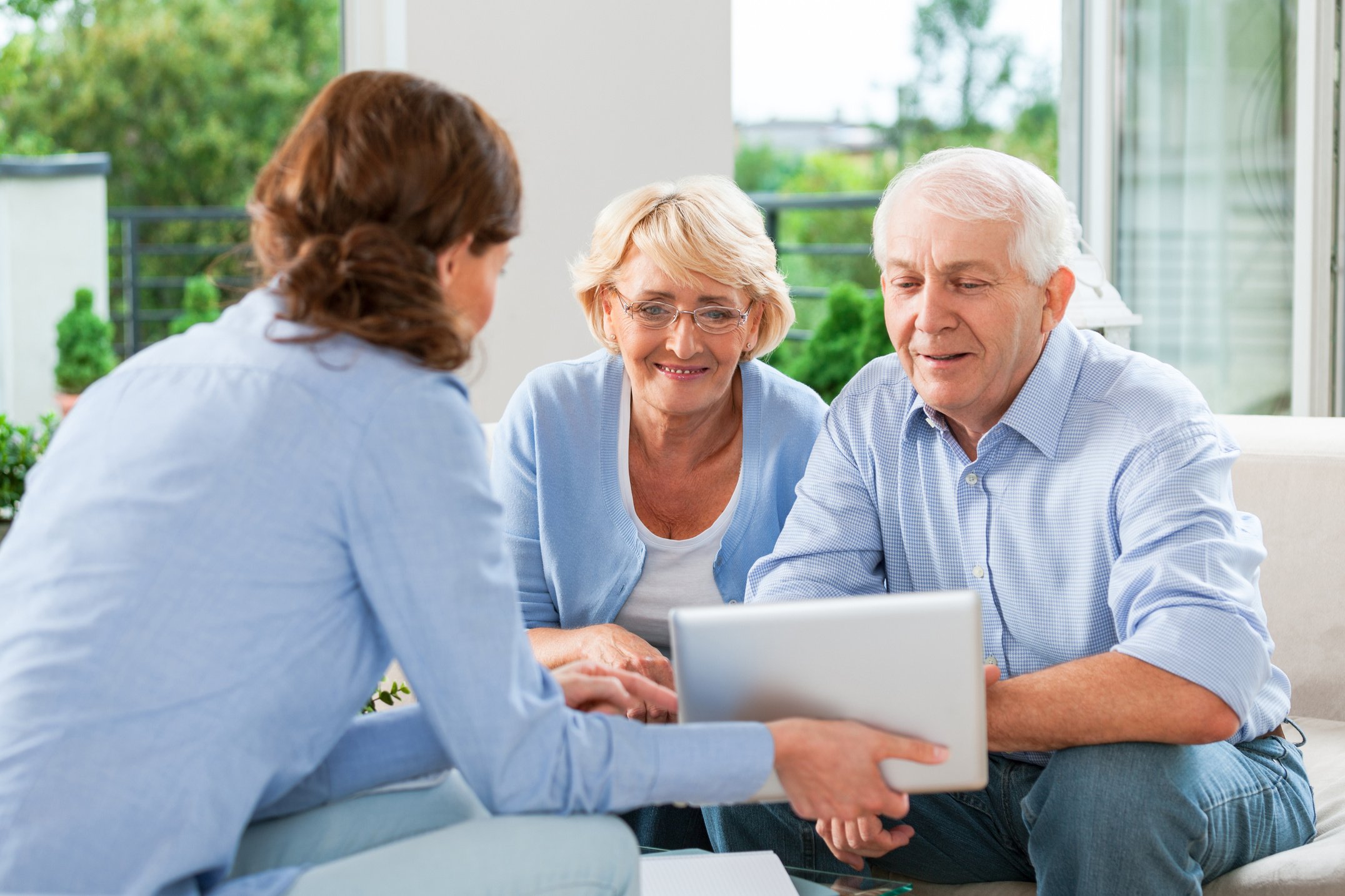 Senior couple talking with insurance agent